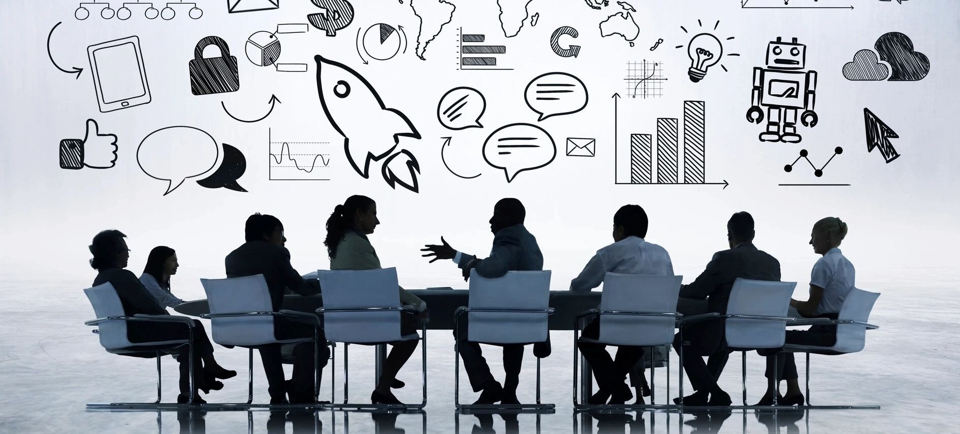 silhouettes of people brainstorming in front of a whiteboard